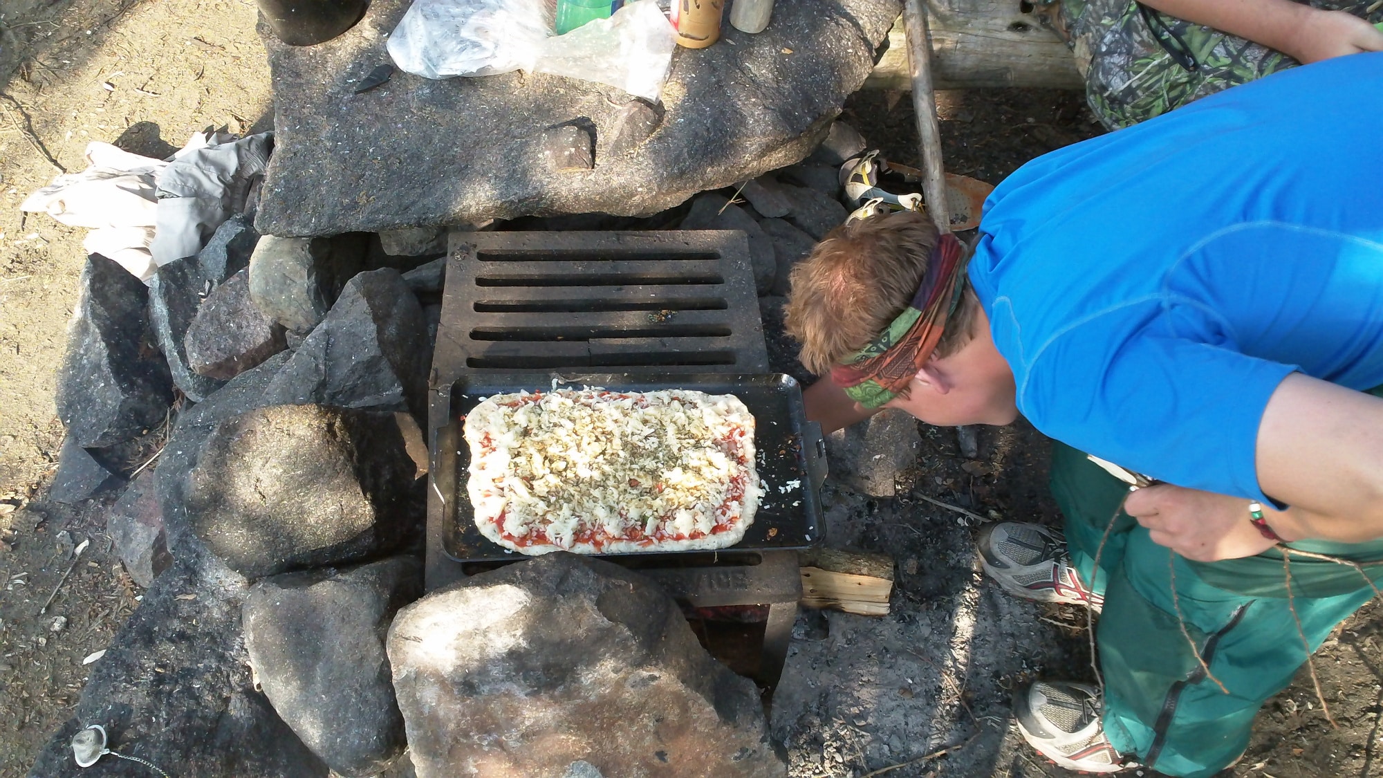 Pizza Cooking Over The Fire In The Bwca