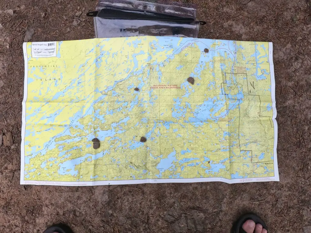 Marking the map on the trail with stones